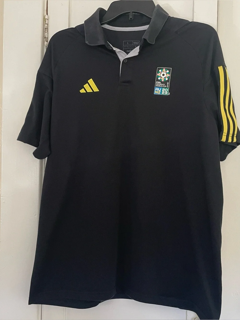 Adidas Men’s Black Polo Shirt with Yellow Accents FIFA women’s World Cup 2023